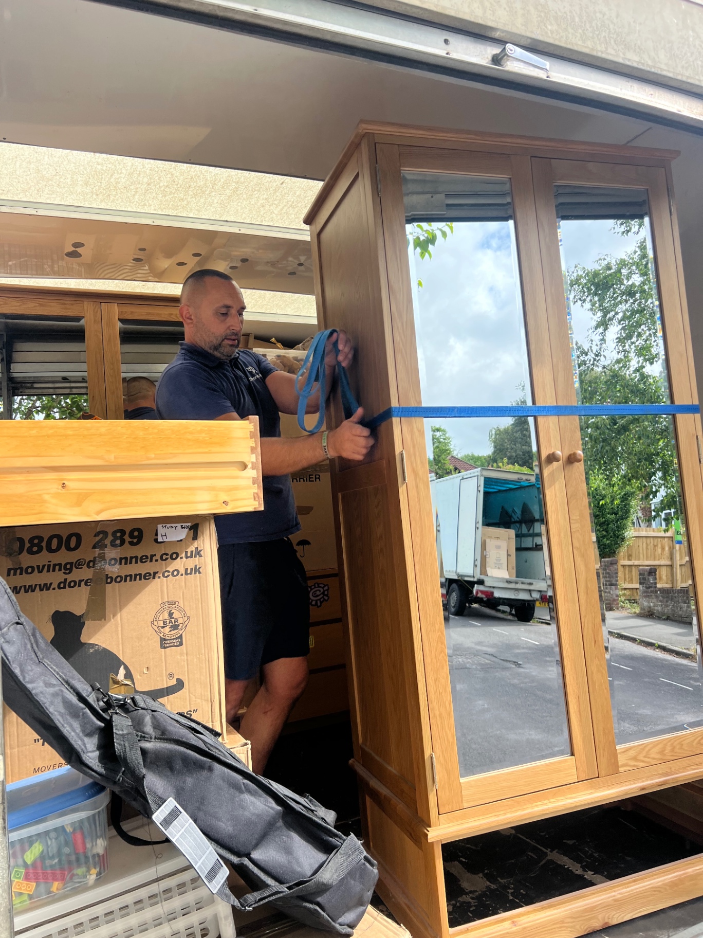 Bristol house removal securing a wardrobe in the van