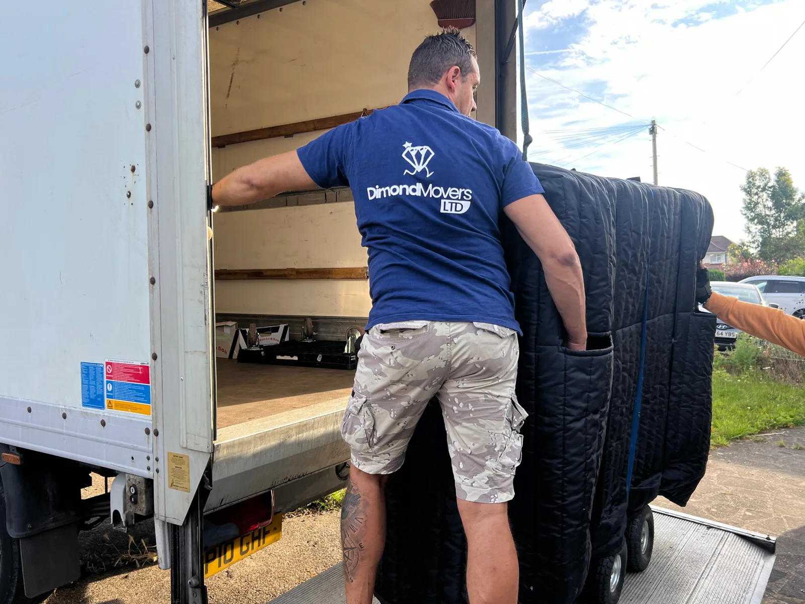 Removals team loading a Luton van on a UK house move